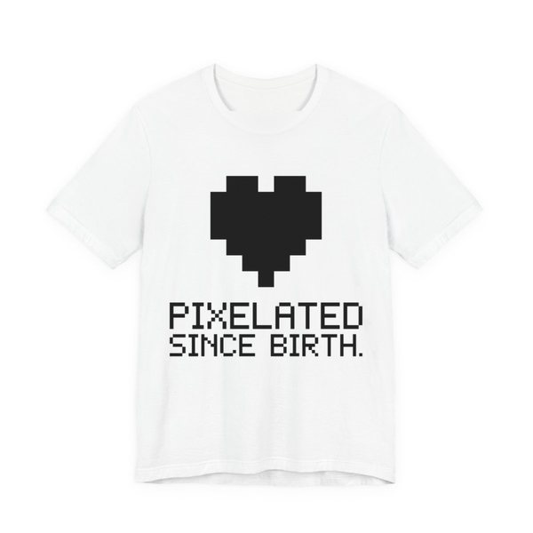 White t-shirt printed in dark ink with a big pixel heart and the words “Pixelated Since Birth.”