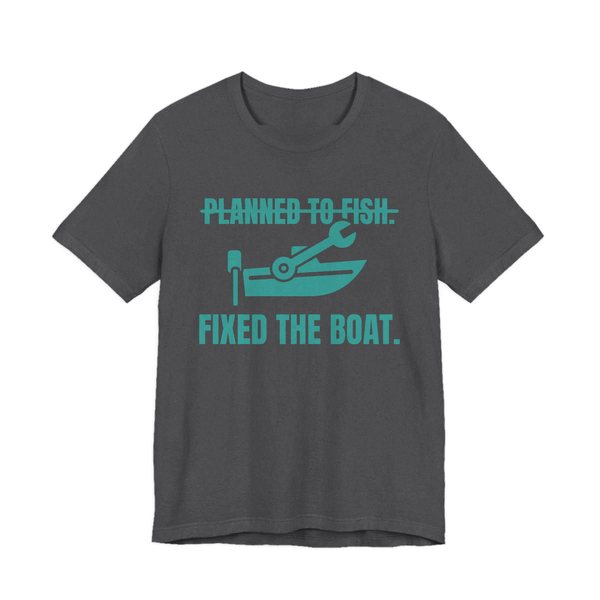 Dark Grey Heather t-shirt printed in teal ink with a boat and a wrench, with “Planned to Fish.” crossed out above “Fixed the Boat.”