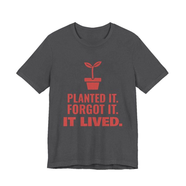 Dark Grey Heather t-shirt printed in tomato red ink with a sprout in a flowerpot and the words “Planted It. Forgot It. It Lived.”