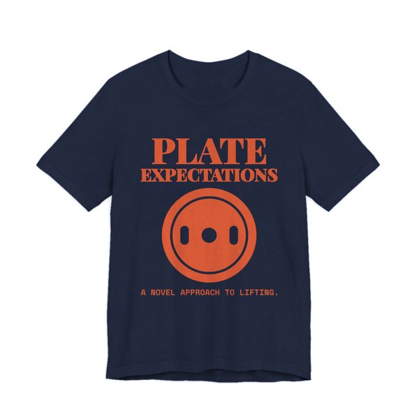 Navy t-shirt printed in orange ink with a weight plate and the words “Plate Expectations. A Novel Approach to Lifting.”