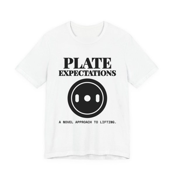White t-shirt printed in dark ink with a weight plate and the words “Plate Expectations. A Novel Approach to Lifting.”