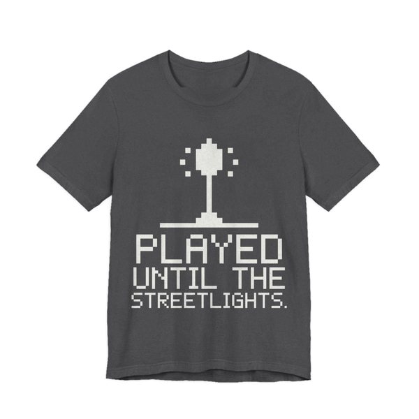 Dark Grey Heather t-shirt printed in off-white ink with a pixel streetlight and the words “Played Until the Streetlights.”