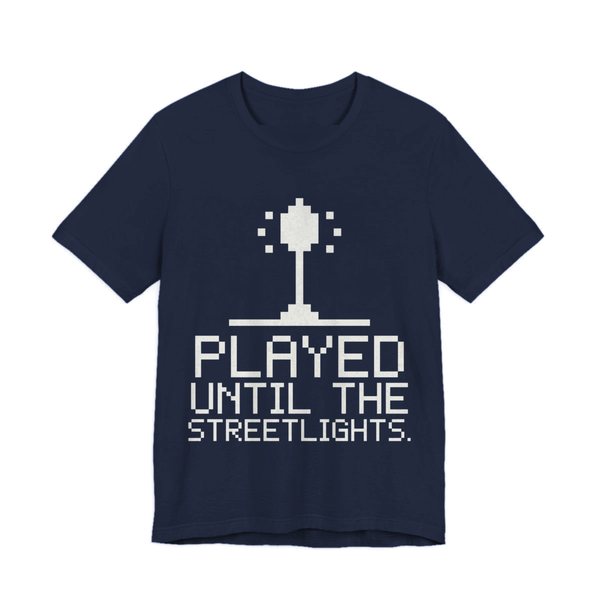 Navy t-shirt printed in off-white ink with a pixel streetlight and the words “Played Until the Streetlights.”