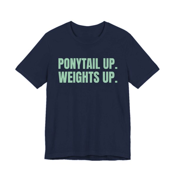 Navy t-shirt printed in mint green ink with the words "Ponytail Up. Weights Up."