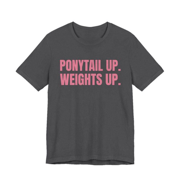 Dark Grey Heather t-shirt printed in rose pink ink with the words "Ponytail Up. Weights Up."