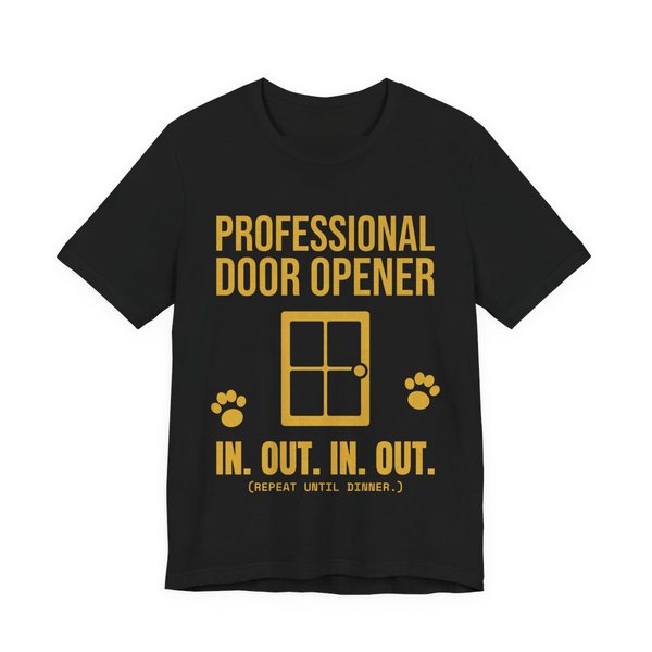 Black t-shirt printed in gold ink with a door, paw prints and the words “Professional Door Opener. In. Out. In. Out. (Repeat until dinner.)”