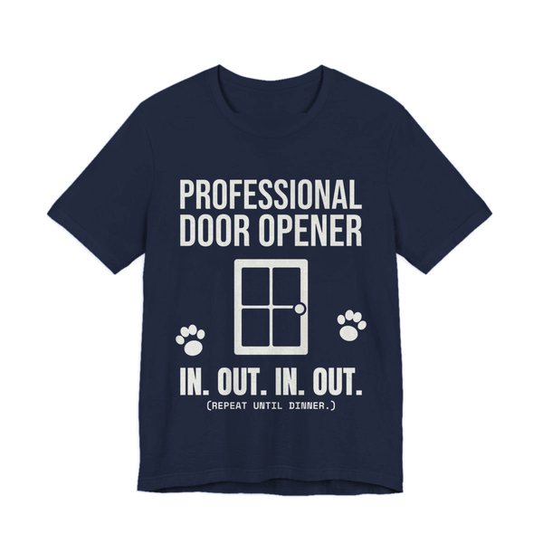 Navy t-shirt printed in off-white ink with a door, paw prints and the words “Professional Door Opener. In. Out. In. Out. (Repeat until dinner.)”