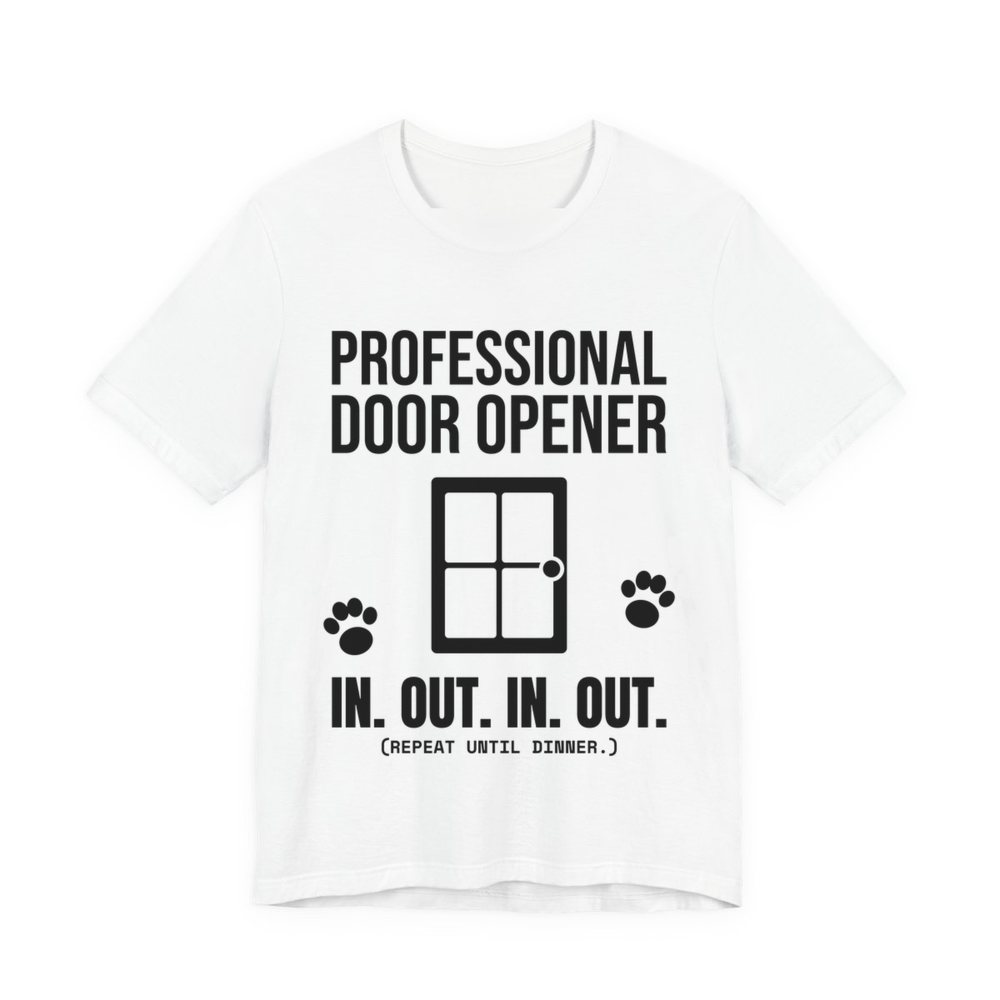 White t-shirt printed in dark ink with a door, paw prints and the words “Professional Door Opener. In. Out. In. Out. (Repeat until dinner.)”