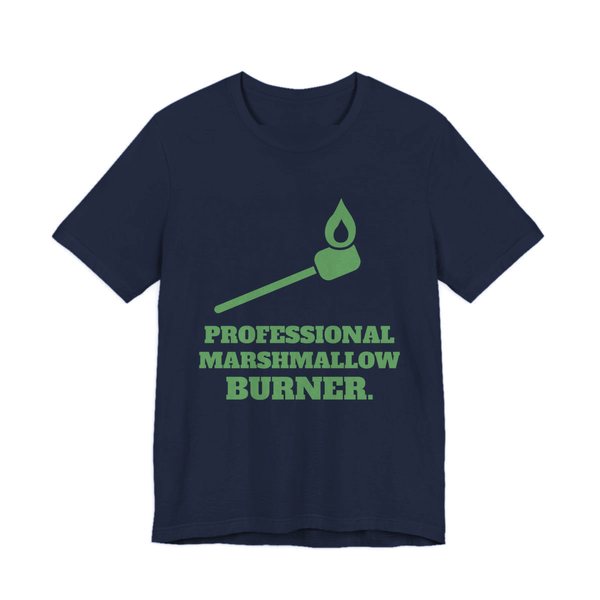Navy t-shirt printed in pine green ink with a flaming marshmallow on a stick and the words “Professional Marshmallow Burner.”
