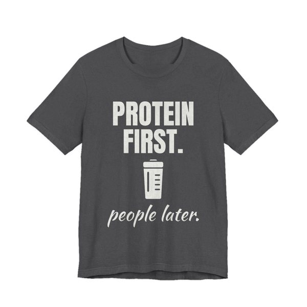 Dark Grey Heather t-shirt printed in off-white ink with a protein shaker and the words “Protein First. People Later.”