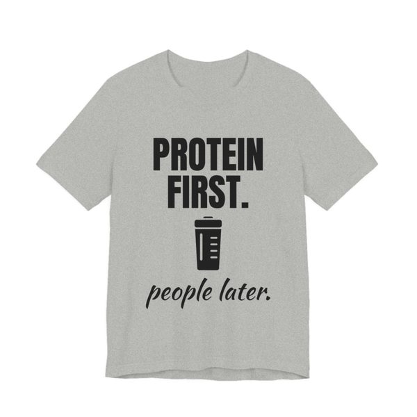 Athletic Heather t-shirt printed in dark ink with a protein shaker and the words “Protein First. People Later.”