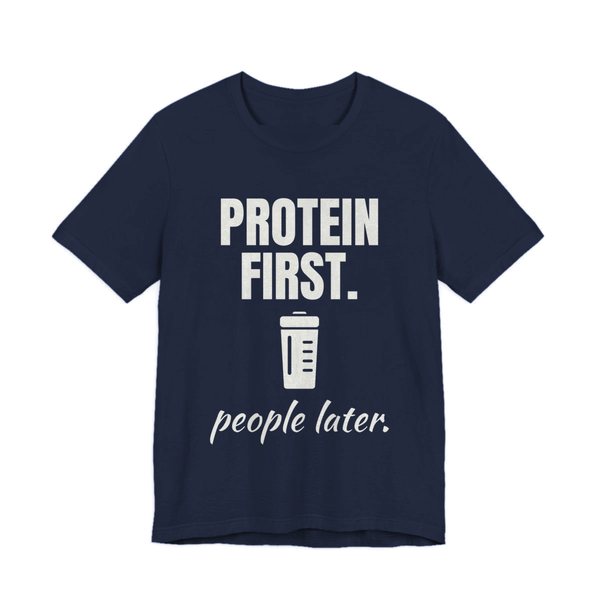 Navy t-shirt printed in off-white ink with a protein shaker and the words “Protein First. People Later.”