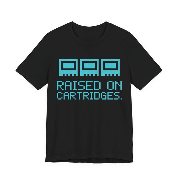 Black t-shirt printed in cyan ink with three plain pixel cartridges and the words “Raised on Cartridges.”