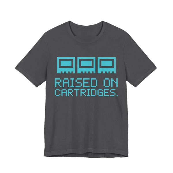 Dark Grey Heather t-shirt printed in cyan ink with three plain pixel cartridges and the words “Raised on Cartridges.”