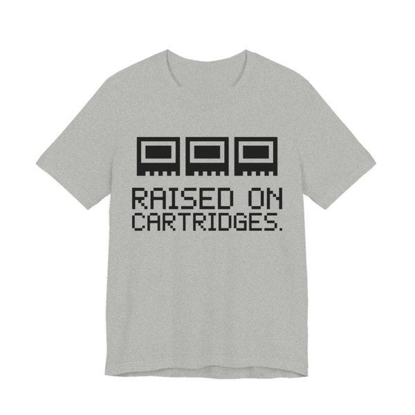 Athletic Heather t-shirt printed in dark ink with three plain pixel cartridges and the words “Raised on Cartridges.”