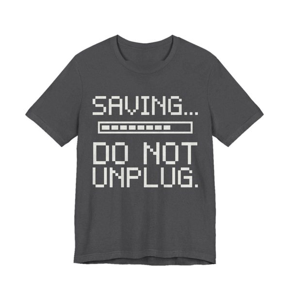Dark Grey Heather t-shirt printed in off-white ink with a pixel progress bar and the words “Saving... Do Not Unplug.”