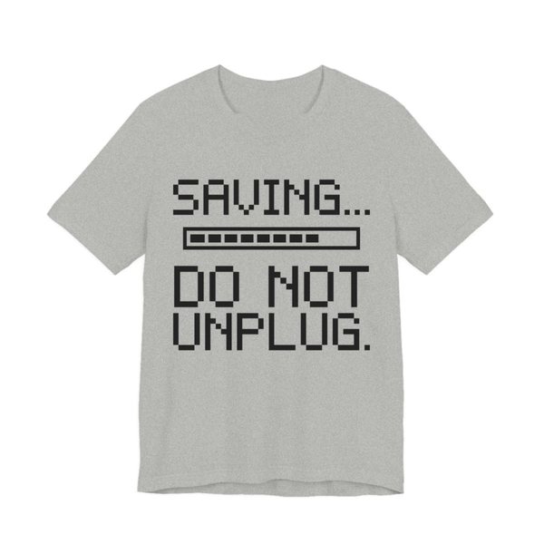 Athletic Heather t-shirt printed in dark ink with a pixel progress bar and the words “Saving... Do Not Unplug.”