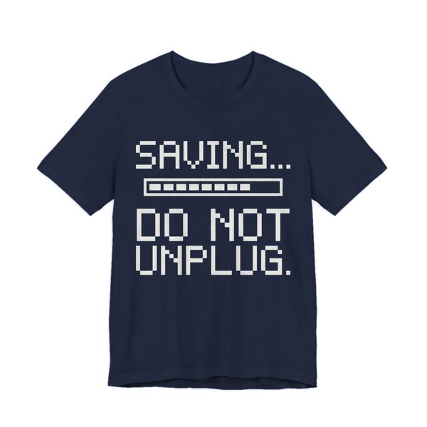 Navy t-shirt printed in off-white ink with a pixel progress bar and the words “Saving... Do Not Unplug.”