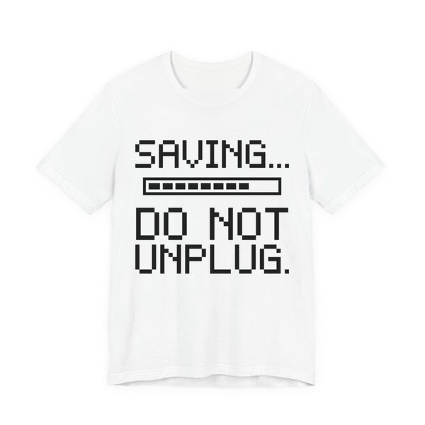 White t-shirt printed in dark ink with a pixel progress bar and the words “Saving... Do Not Unplug.”