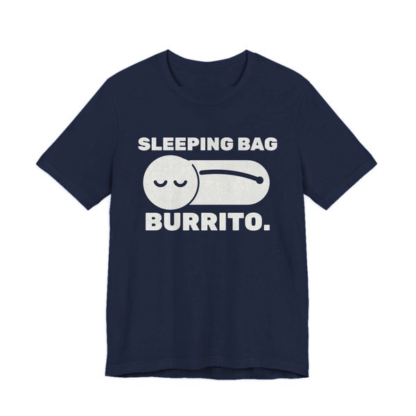 Navy t-shirt printed in off-white ink with a sleeper zipped into a sleeping bag and the words “Sleeping Bag Burrito.”
