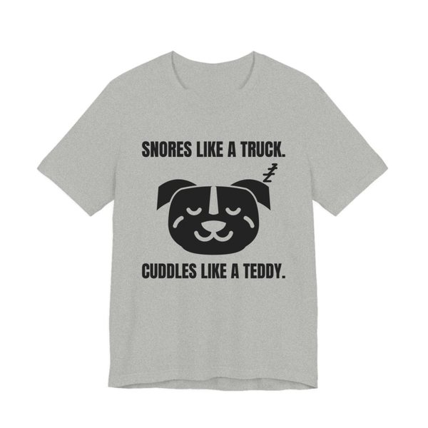 Athletic Heather t-shirt printed in dark ink with a sleeping pit bull face and the words “Snores Like a Truck. Cuddles Like a Teddy.”