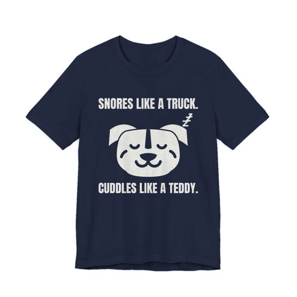 Navy t-shirt printed in off-white ink with a sleeping pit bull face and the words “Snores Like a Truck. Cuddles Like a Teddy.”