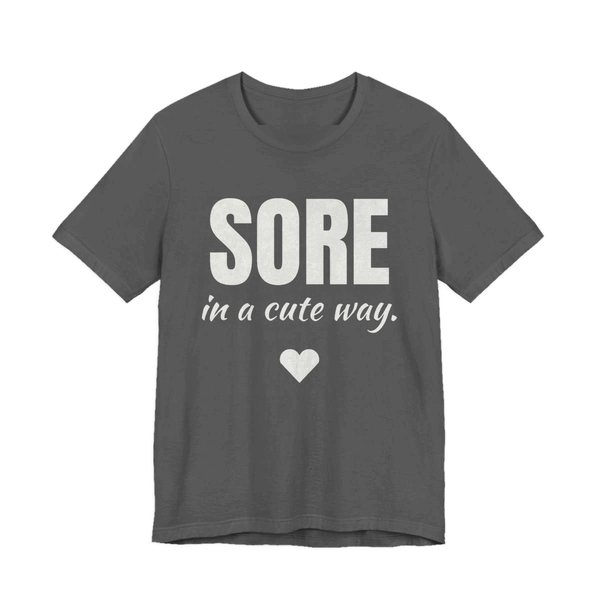 Asphalt t-shirt printed in off-white ink with a heart and the words "Sore in a Cute Way."