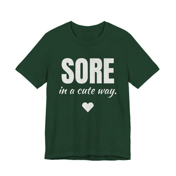 Forest t-shirt printed in off-white ink with a heart and the words "Sore in a Cute Way."