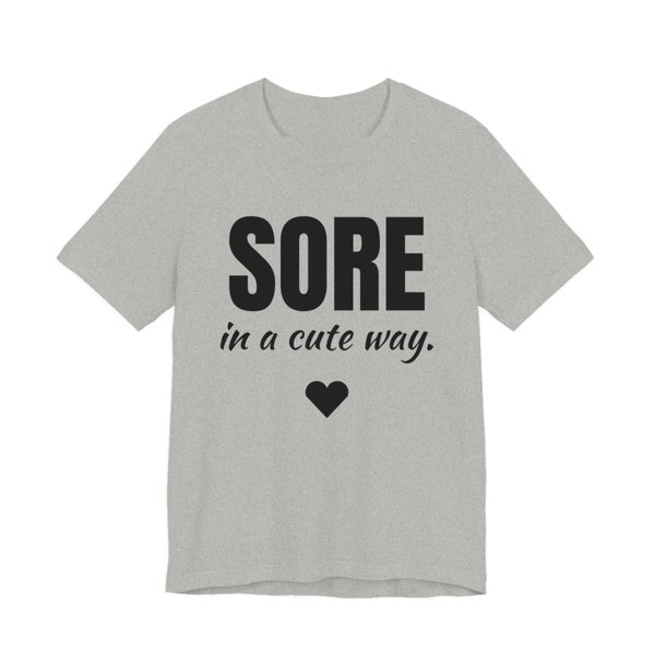 Athletic Heather t-shirt printed in dark ink with a heart and the words "Sore in a Cute Way."