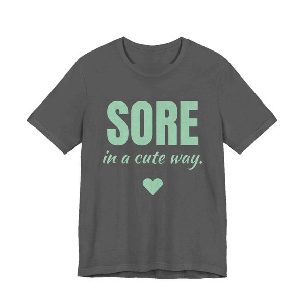 Asphalt t-shirt printed in mint green ink with a heart and the words "Sore in a Cute Way."