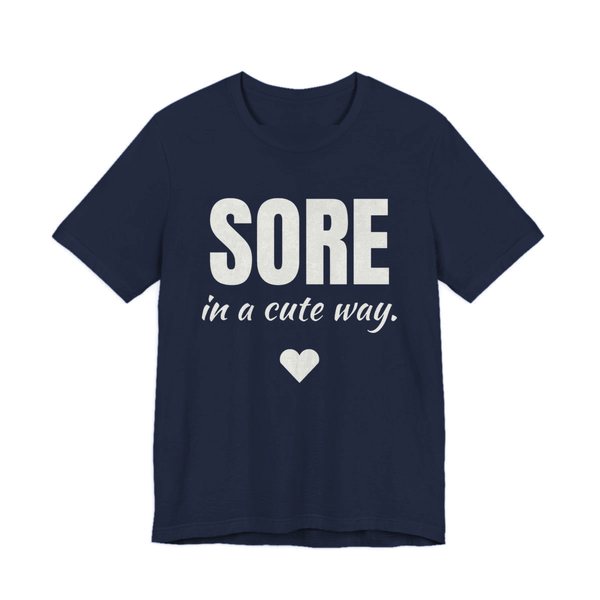 Navy t-shirt printed in off-white ink with a heart and the words "Sore in a Cute Way."