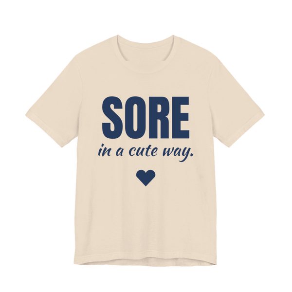 Soft Cream t-shirt printed in navy blue ink with a heart and the words "Sore in a Cute Way."