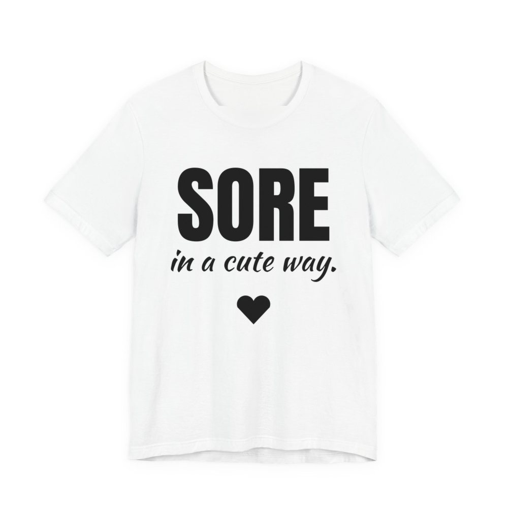 White t-shirt printed in dark ink with a heart and the words "Sore in a Cute Way."