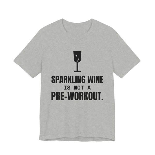 Athletic Heather t-shirt printed in dark ink with a glass of sparkling wine and the words “Sparkling Wine Is Not a Pre-Workout.”