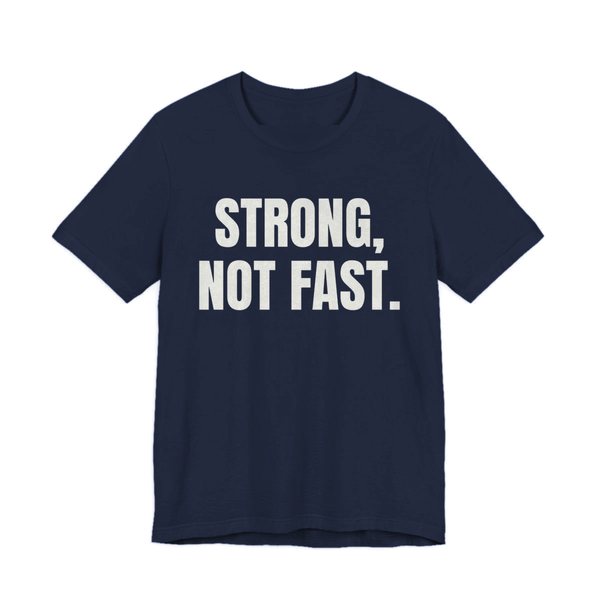 Navy t-shirt printed in off-white ink with the words "Strong, Not Fast."