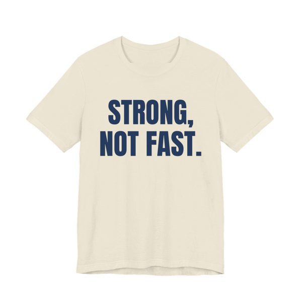Natural t-shirt printed in navy blue ink with the words "Strong, Not Fast."