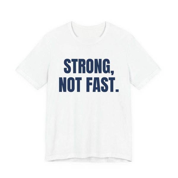 White t-shirt printed in navy blue ink with the words "Strong, Not Fast."