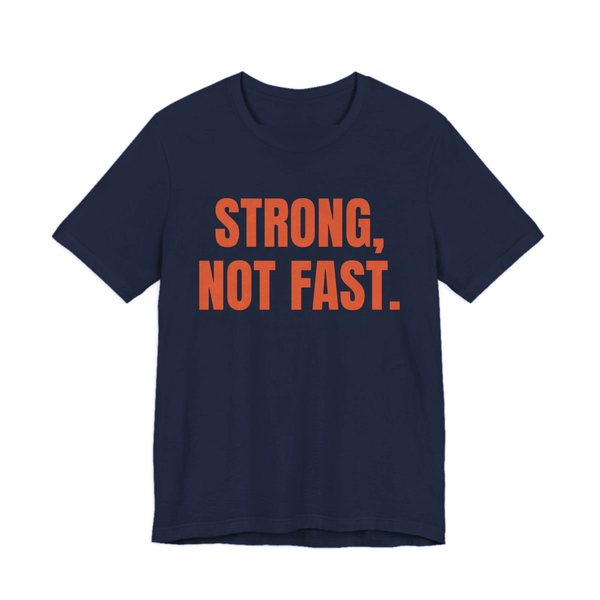 Navy t-shirt printed in orange ink with the words "Strong, Not Fast."