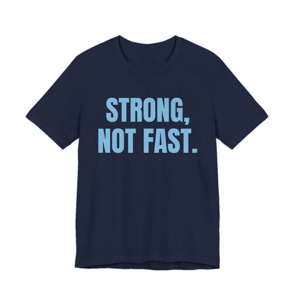 Navy t-shirt printed in sky blue ink with the words "Strong, Not Fast."