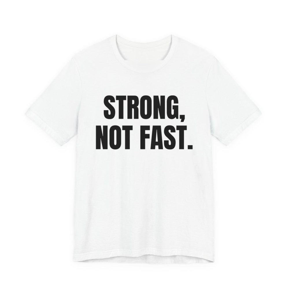 White t-shirt printed in dark ink with the words "Strong, Not Fast."