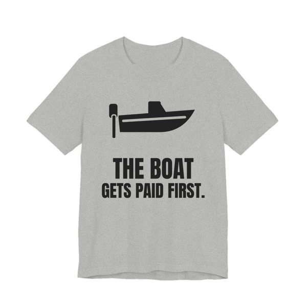 Athletic Heather t-shirt printed in dark ink with a boat with an outboard motor and the words “The Boat Gets Paid First.”