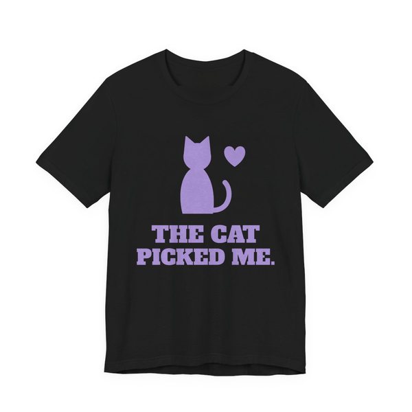 Black t-shirt printed in lavender ink with a sitting cat with a heart and the words “The Cat Picked Me.”