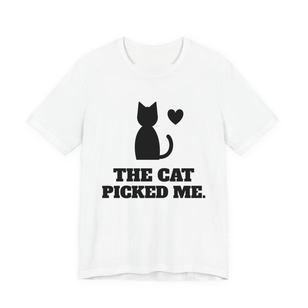White t-shirt printed in dark ink with a sitting cat with a heart and the words “The Cat Picked Me.”