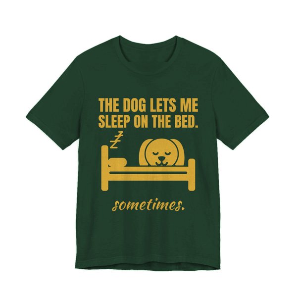 Forest t-shirt printed in gold ink with a dog asleep in a bed and the words “The Dog Lets Me Sleep on the Bed. Sometimes.”