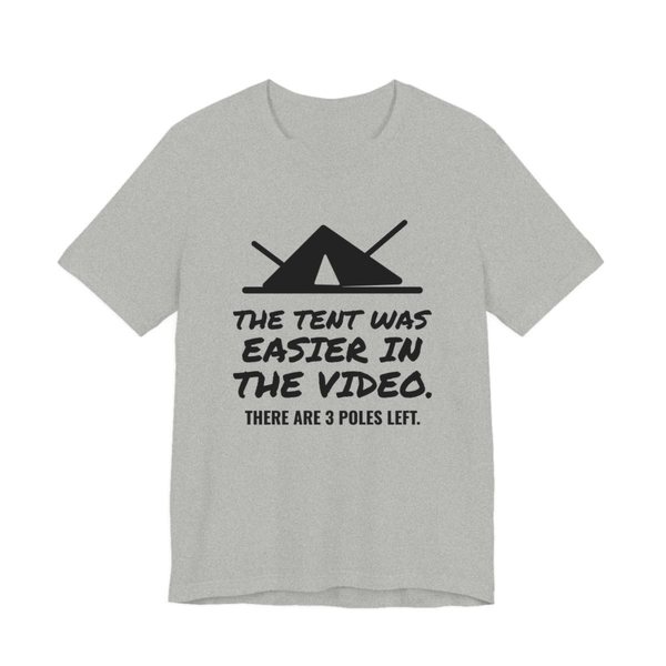 Athletic Heather t-shirt printed in dark ink with a pitched tent with spare poles and the words “The Tent Was Easier in the Video. There are 3 poles left.”