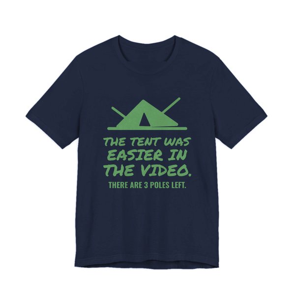 Navy t-shirt printed in pine green ink with a pitched tent with spare poles and the words “The Tent Was Easier in the Video. There are 3 poles left.”
