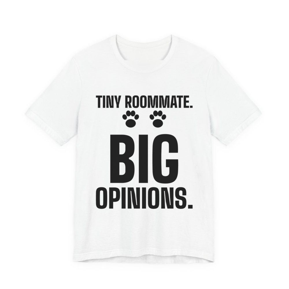 White t-shirt printed in dark ink with paw prints and the words “Tiny Roommate. Big Opinions.”