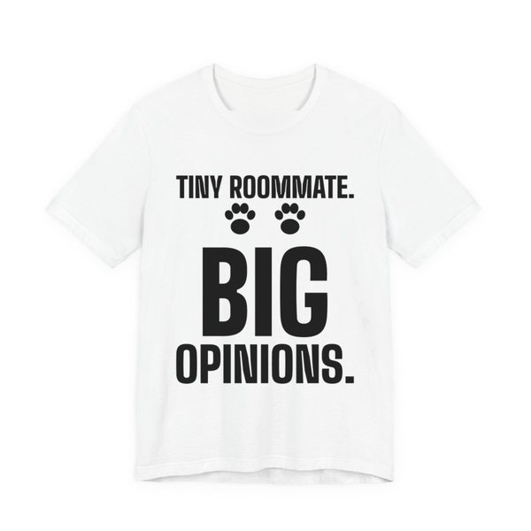 White t-shirt printed in dark ink with paw prints and the words “Tiny Roommate. Big Opinions.”