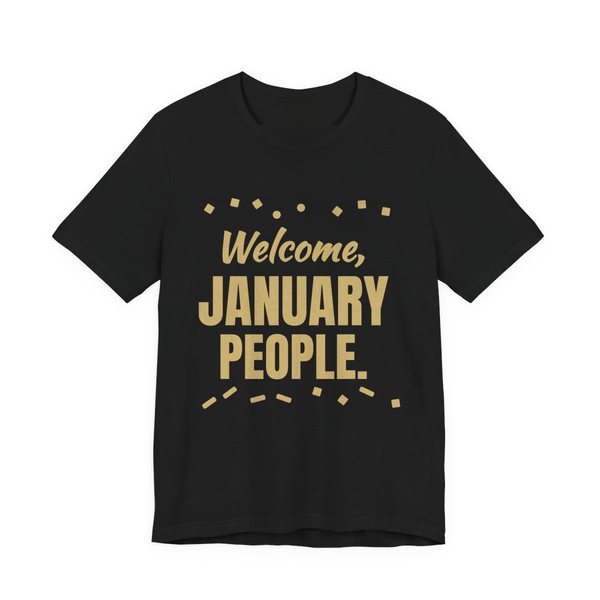 Black t-shirt printed in champagne gold ink with confetti and the words “Welcome, January People.”