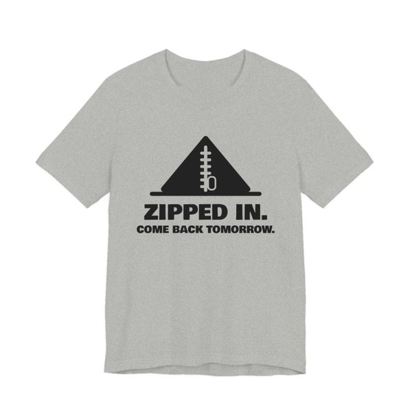 Athletic Heather t-shirt printed in dark ink with a zipped-up tent and the words “Zipped In. Come Back Tomorrow.”